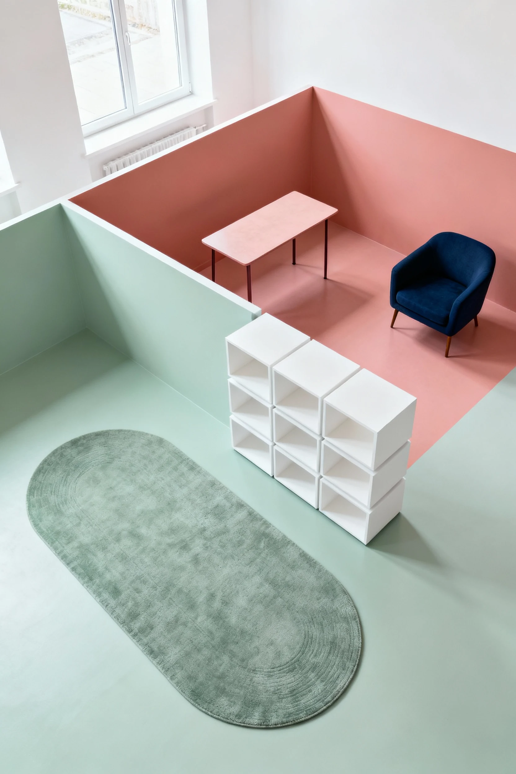 4. Overhead photorealistic shot of a color-block living cube: soft sage living area with an oval rug, muted coral dining